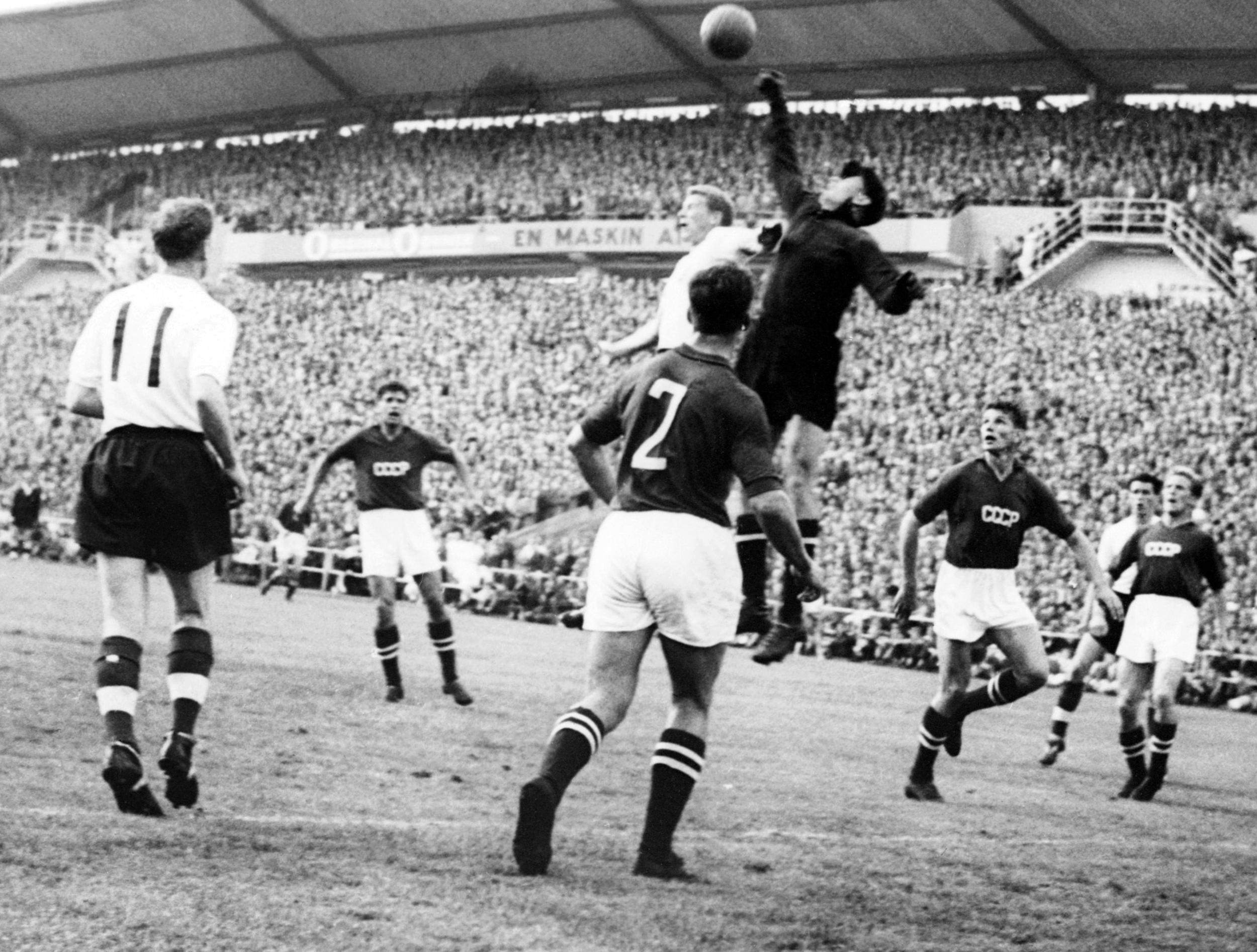 Goalkeeper Lev Yashin (black) from the Soviet Union boxes the ball away from an English player during the World Cup first round soccer match between the Soviet Union and England 08 June 1958 in Goteborg. The match ended in a 2-2 tie. AFP PHOTO/PRESSENBILD (Photo credit should read STAFF/AFP via Getty Images)