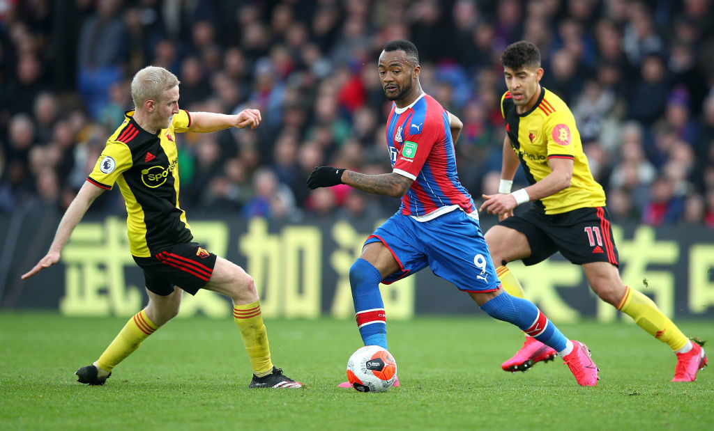 LONDON, ENGLAND - MARCH 07: Jordan Ayew of Crystal Palace is challenged by Will Hughes of Watford and Adam Masina of Watford during the Premier League match between Crystal Palace and Watford FC at Selhurst Park on March 07, 2020 in London, United Kingdom. (Photo by Christopher Lee/Getty Images)