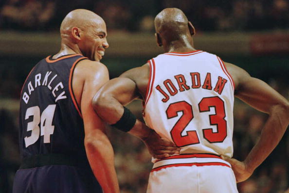 CHICAGO, IL - JANUARY 28:  Phoenix Suns forward Charles Barkley (34) laughs at a foul call with Chicago Bulls guard Michael Jordan (23) in the first half 28 January 1996 at the United Center in Chicago.  The Bulls won 93-82. Jordan scored 31 points, and Barkley scored 20 with 16 rebounds.  (Photo credit should read BRIAN BAHR/AFP via Getty Images)