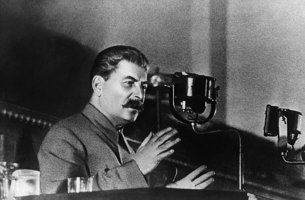 Soviet leader Joseph Stalin reports to the 8th All-Union Congress of Soviets on the draft Constitution of the USSR. (Photo by © Hulton-Deutsch Collection/CORBIS/Corbis via Getty Images)