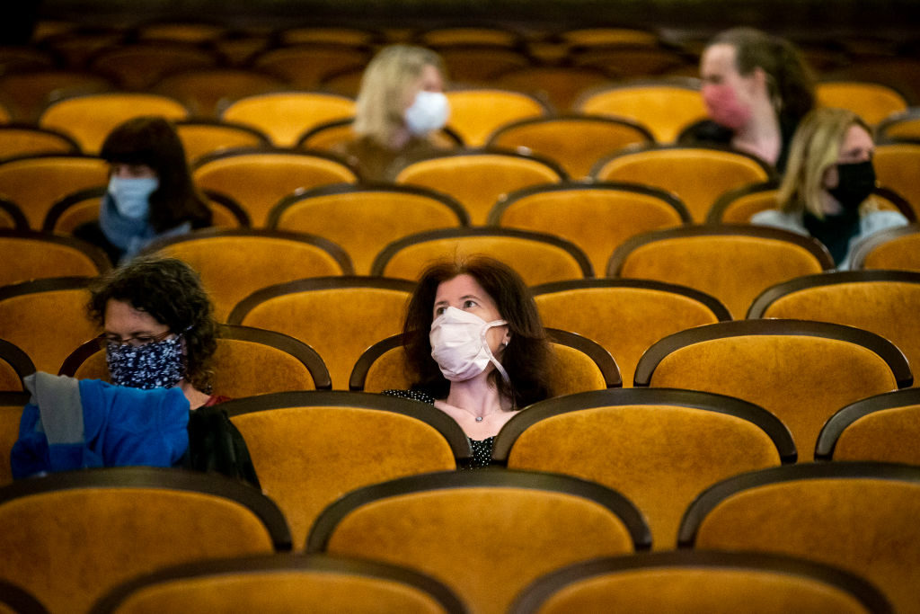 PRAGUE, CZECH REPUBLIC - MAY 11: Customers wearing protective masks sit apart in observance of social distancing measures inside a movie theater as the Czech government lifted more restrictions allowing cinemas to re-open on May 11, 2020, in Prague, Czech Republic. The Czech government has begun further easing the restrictive measures to slow down the spread of the pandemic COVID-19 disease during the lockdown. (Photo by Gabriel Kuchta/Getty Images)