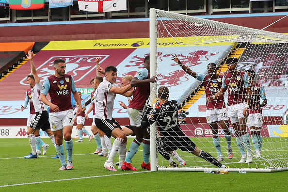 BIRMINGHAM, ENGLAND - JUNE 17: Orjan Nyland of Aston Villa fumbles and pulls the ball from being the line but Referee Michael Oliver calls a no goal as the goal line technology fails during the Premier League match between Aston Villa and Sheffield United at Villa Park on June 17, 2020 in Birmingham, United Kingdom. (Photo by Matthew Ashton - AMA/Getty Images)