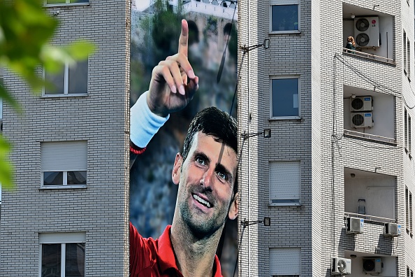A billboard depicting Serbian tennis player Novak Djokovic and the Christian Orthodox monastery of Ostrog is seen on a building in Belgrade on June 24, 2020. - Novak Djokovic has also tested positive for coronavirus on June 23, 2020 along with Grigor Dimitrov, Borna Coric and Viktor Troicki, after taking part in an exhibition tennis tournament in the Balkans featuring world number one Novak Djokovic, raising questions over the sport's planned return in August. (Photo by ANDREJ ISAKOVIC / AFP) (Photo by ANDREJ ISAKOVIC/AFP via Getty Images)