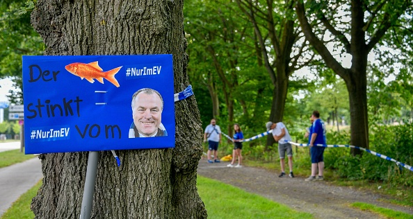 Schalke's supervisory board chairman Clemens Toennies is seen on a placard as fans of Bundesliga football club Schalke 04 form a human chain to protest against the club's management on June 27, 2020 around the arena and the training ground in Gelsenkirchen, western Germany, at the same time as the kick-off of the last match of the season against Freiburg. - The demonstration took place under the motto "Schalke is not an abattoir - against the dismantling of our club", as lockdowns in Guetersloh and neighbouring Warendorf in western Germany came after a coronavirus outbreak at a slaughterhouse of Toennies company. (Photo by SASCHA SCHUERMANN / AFP) (Photo by SASCHA SCHUERMANN/AFP via Getty Images)