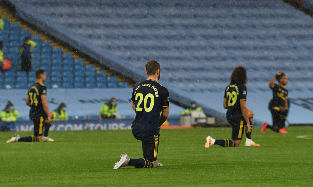 MANCHESTER, ENGLAND - JUNE 17: Shkodran Mustafi of Arsenal takes knee in support of Black Live Matter before the Premier League match between Manchester City and Arsenal FC at Etihad Stadium on June 17, 2020 in Manchester, England. (Photo by David Price/Arsenal FC via Getty Images)