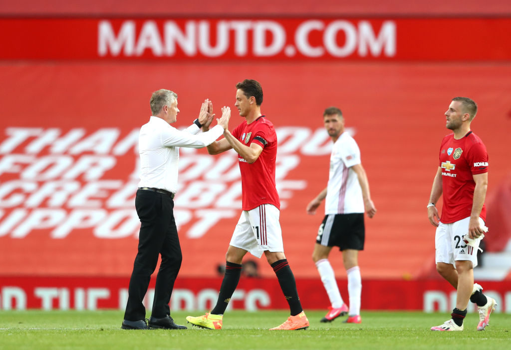 MANCHESTER, ENGLAND - JUNE 24: Ole Gunnar Solskjaer, Manager of anchester United  interacts with Nemanja Matic after the Premier League match between Manchester United and Sheffield United at Old Trafford on June 24, 2020 in Manchester, England. (Photo by Michael Steele/Getty Images)