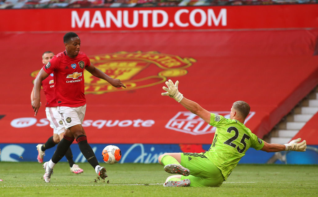 MANCHESTER, ENGLAND - JUNE 24:  Anthony Martial of Manchester United scores his third goal past Simon Moore of Sheffield United during the Premier League match between Manchester United and Sheffield United at Old Trafford on June 24, 2020 in Manchester, England. (Photo by Alex Livesey - Danehouse/Getty Images)