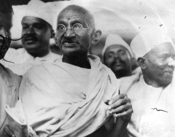 Mahatma Gandhi (Mohandas Karamchand Gandhi,1869 - 1948), Indian nationalist and spiritual leader, leading the Salt March in protest against the government monopoly on salt production.   (Photo by Central Press/Getty Images)