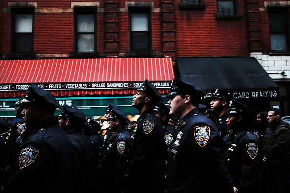 NEW YORK, NY - MARCH 14:  Auxiliary police officers participate in a memorial service for the 8 year anniversary of the killing of two unarmed auxiliary police officers in the West Village in New York City on March 14, 2015 in New York City. 
The service, which was held at the location of the 2007 crime, was attended by dozens of officers and family members of the victims 19-year-old Eugene Marshalik, a NYU student, and Nicholas Pekearo, 28. On the night of March 14, 2007 a man fired over 100 rounds of ammunition shooting and killing a pizzeria employee in Greenwich Village before fatally shooting the two auxiliary police officers. Police officers shot him on Bleecker Street.  (Photo by Spencer Platt/Getty Images)