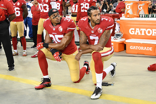 SANTA CLARA, CA - SEPTEMBER 12: Colin Kaepernick #7 and Eric Reid #35 of the San Francisco 49ers kneel in protest during the national anthem prior to playing the Los Angeles Rams in their NFL game at Levi's Stadium on September 12, 2016 in Santa Clara, California. (Photo by Thearon W. Henderson/Getty Images)