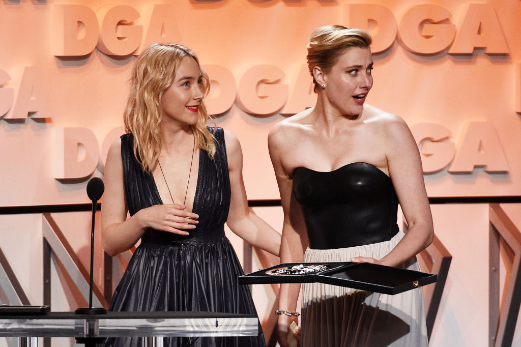 BEVERLY HILLS, CA - FEBRUARY 03:  Director Greta Gerwig (R) accepts the Nomination Medallion for Outstanding Directorial Achievement in Feature Film for 'Lady Bird' from actor Saoirse Ronan onstage during the 70th Annual Directors Guild Of America Awards at The Beverly Hilton Hotel on February 3, 2018 in Beverly Hills, California.  (Photo by Kevork Djansezian/Getty Images for DGA)
