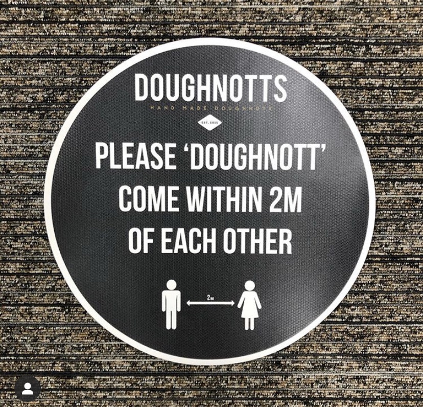Social distancing sign at Doughnotts
