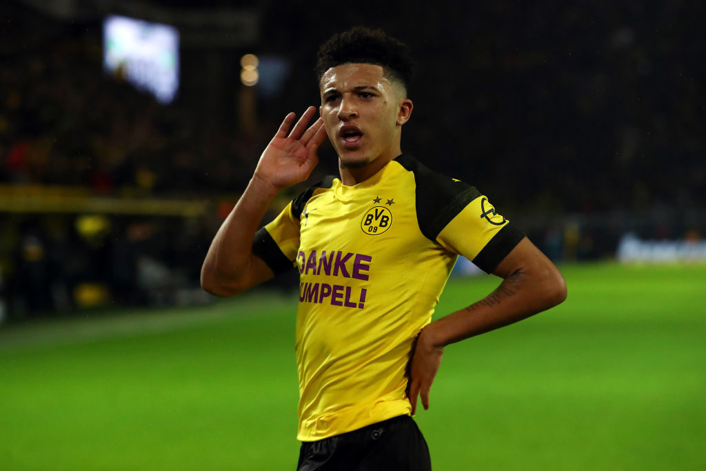 DORTMUND, GERMANY - DECEMBER 21:  Jadon Sancho of Borussia Dortmund celebrates scoring his side's first goal during the Bundesliga match between Borussia Dortmund and Borussia Moenchengladbach at Signal Iduna Park on December 21, 2018 in Dortmund, Germany. (Photo by Dean Mouhtaropoulos/Bongarts/Getty Images)
