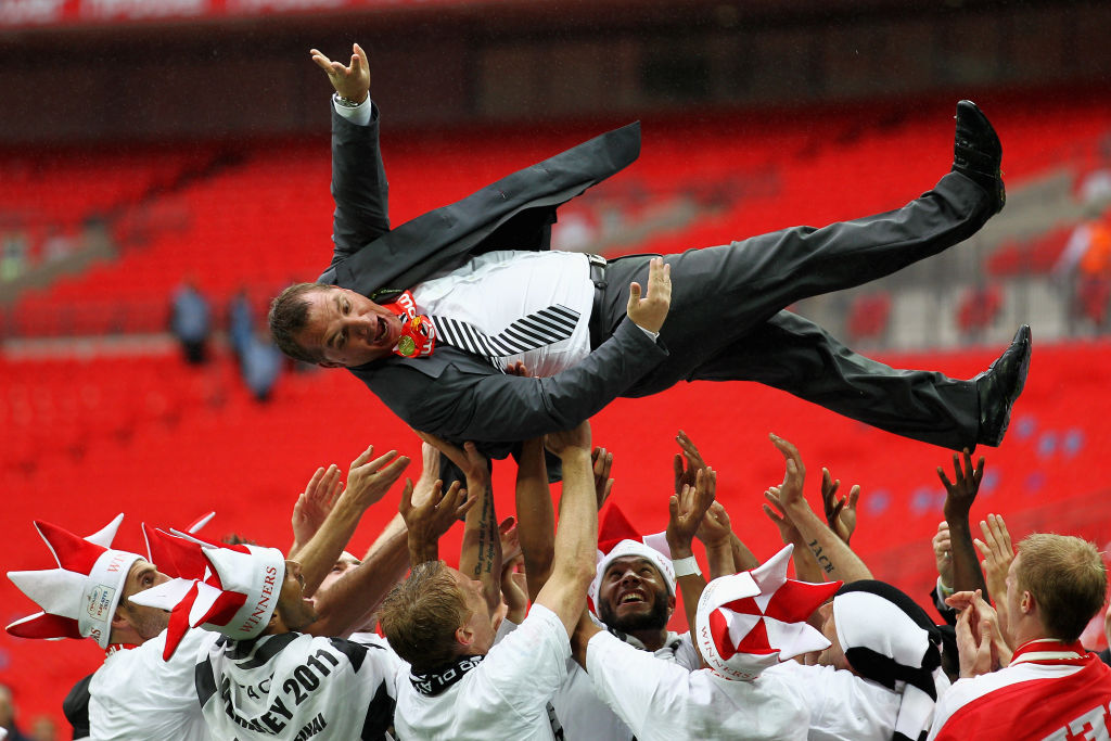 LONDON, ENGLAND - MAY 30:  Swansea Manager, Brendan Rodgers is thrown in the air by his players after winning the npower Championship Playoff Final between Reading and Swansea City at Wembley Stadium on May 30, 2011 in London, England.  (Photo by Dean Mouhtaropoulos/Getty Images)