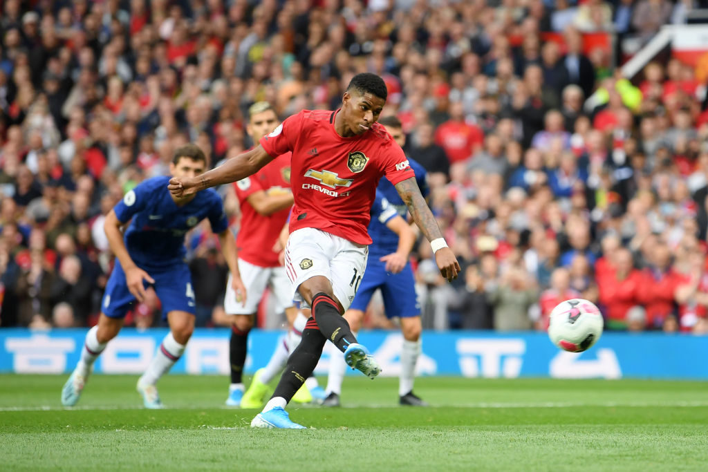 MANCHESTER, ENGLAND - AUGUST 11: Marcus Rashford of Manchester United scores his team's first goal from the penalty spot during the Premier League match between Manchester United and Chelsea FC at Old Trafford on August 11, 2019 in Manchester, United Kingdom. (Photo by Michael Regan/Getty Images)
