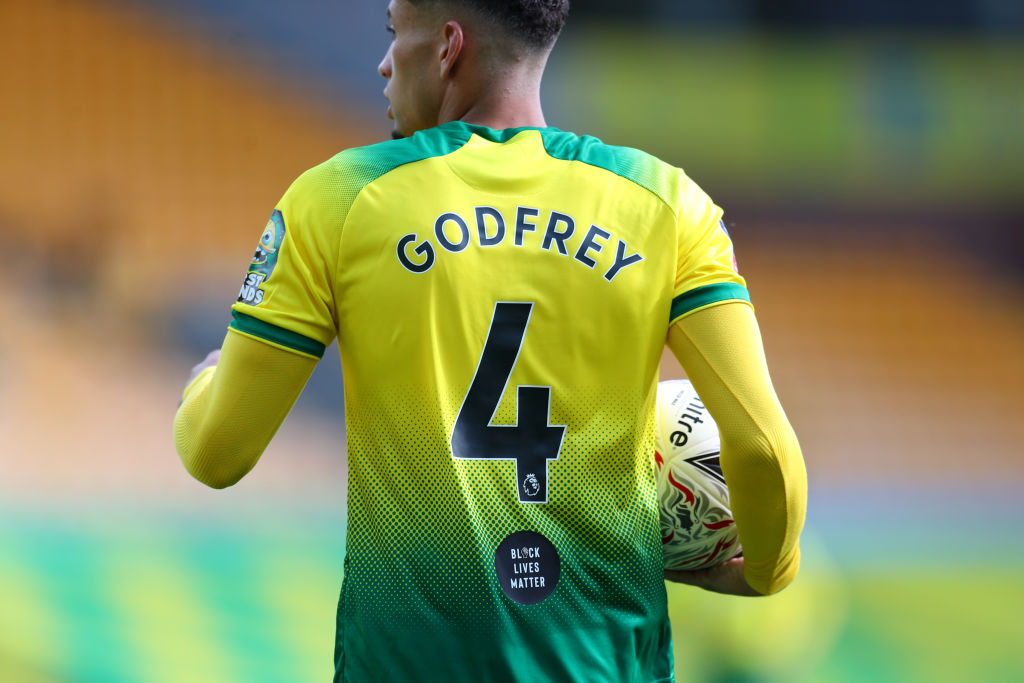 NORWICH, ENGLAND - JUNE 27: The Black Lives Matter movement logo is seen on the back of Ben Godfrey of Norwich City shirt during the FA Cup Quarter Final match between Norwich City and Manchester United at Carrow Road on June 27, 2020 in Norwich, England. (Photo by Catherine Ivill/Getty Images)