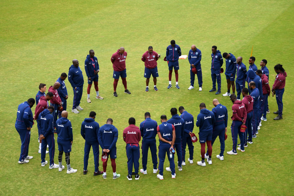 MANCHESTER, ENGLAND - JULY 02: The West Indies team observe a minutes silence in memory of former West Indies batsman Sir Everton Weekes who passed away yesterday prior to the start of play during Day Four of the West Indies Warm Up Match at Old Trafford on July 02, 2020 in Manchester, England. (Photo by Gareth Copley/Getty Images for ECB)