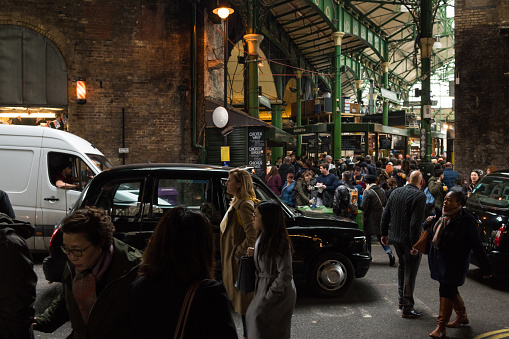 London, United Kingdom - march 20, 2019: A crowd at the famous Borough Market late in the day. The market is Londons oldest open food market and draws thousands of travelers from around the world.