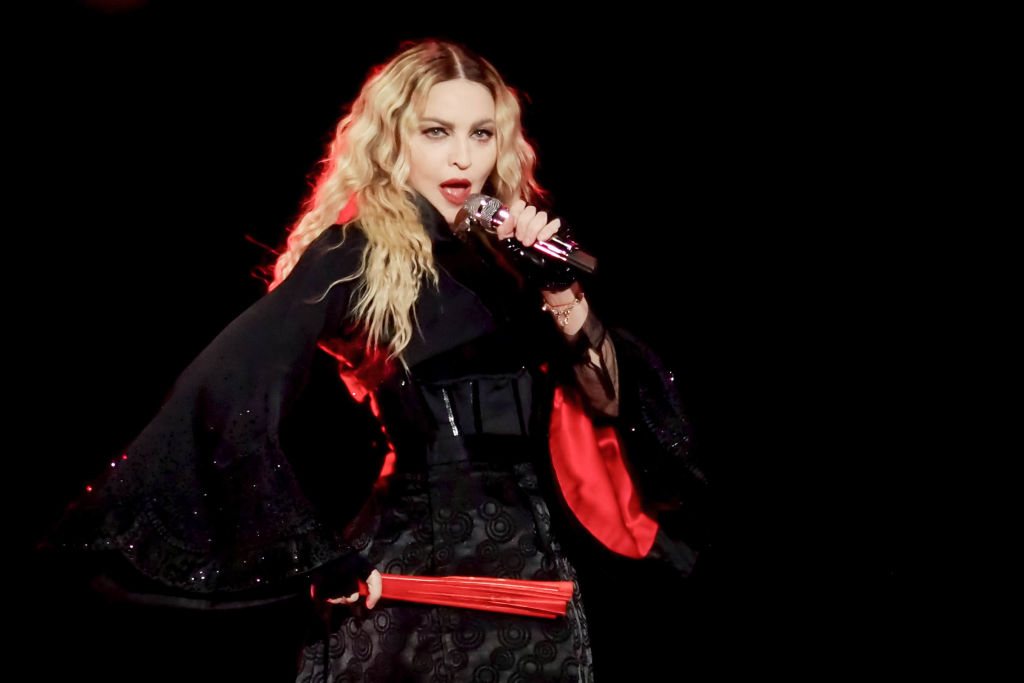 Fans: 'Did Madonna get butt implants?' As singer shows off hip scar