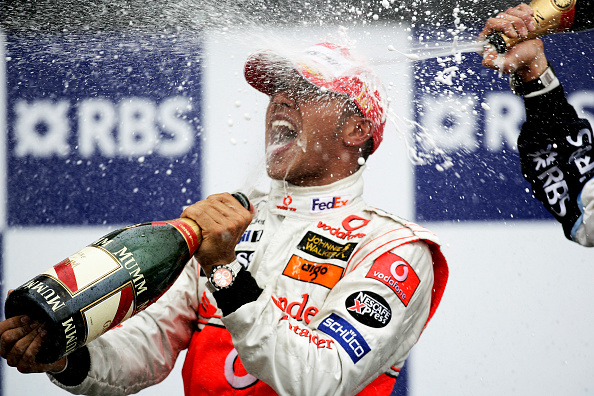Where did Lewis Hamilton win his first grand prix?