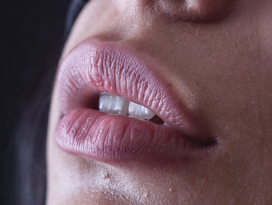 What is the meaning behind the phrase 'rubber lips'?