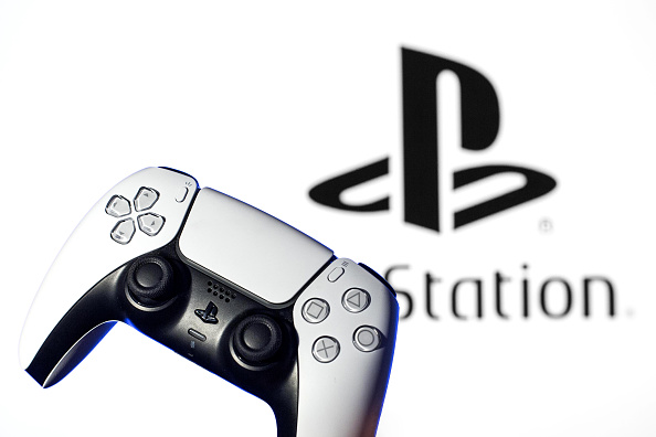 In this photo illustration, a PlayStation 5 controller seen