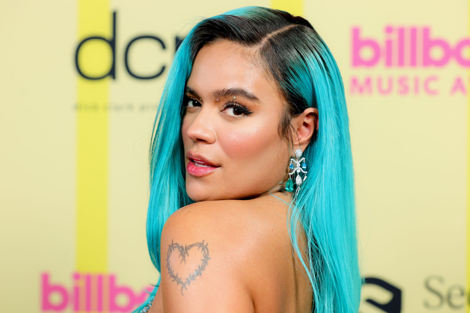 Karol G Reveals the Meaning Behind Her Barbed Heart Tattoo — Interview