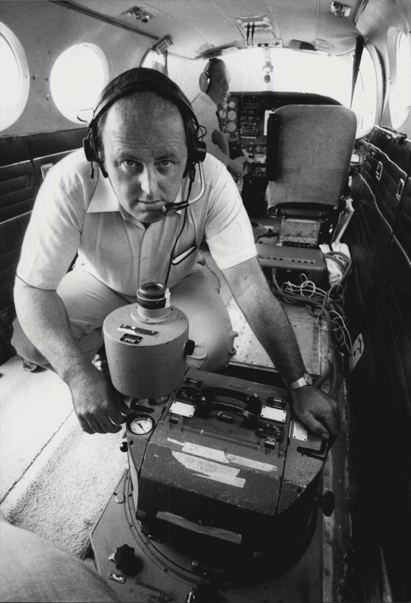 Aerial Survey Photography, Private Enterprise in Trouble after state Government told all its Government Dpts. To use Government Survey in Bathurst.Pictured is Bernie Moriarty, Director of "QASCO" aerial photography mapping co... in the cabin of plane oper