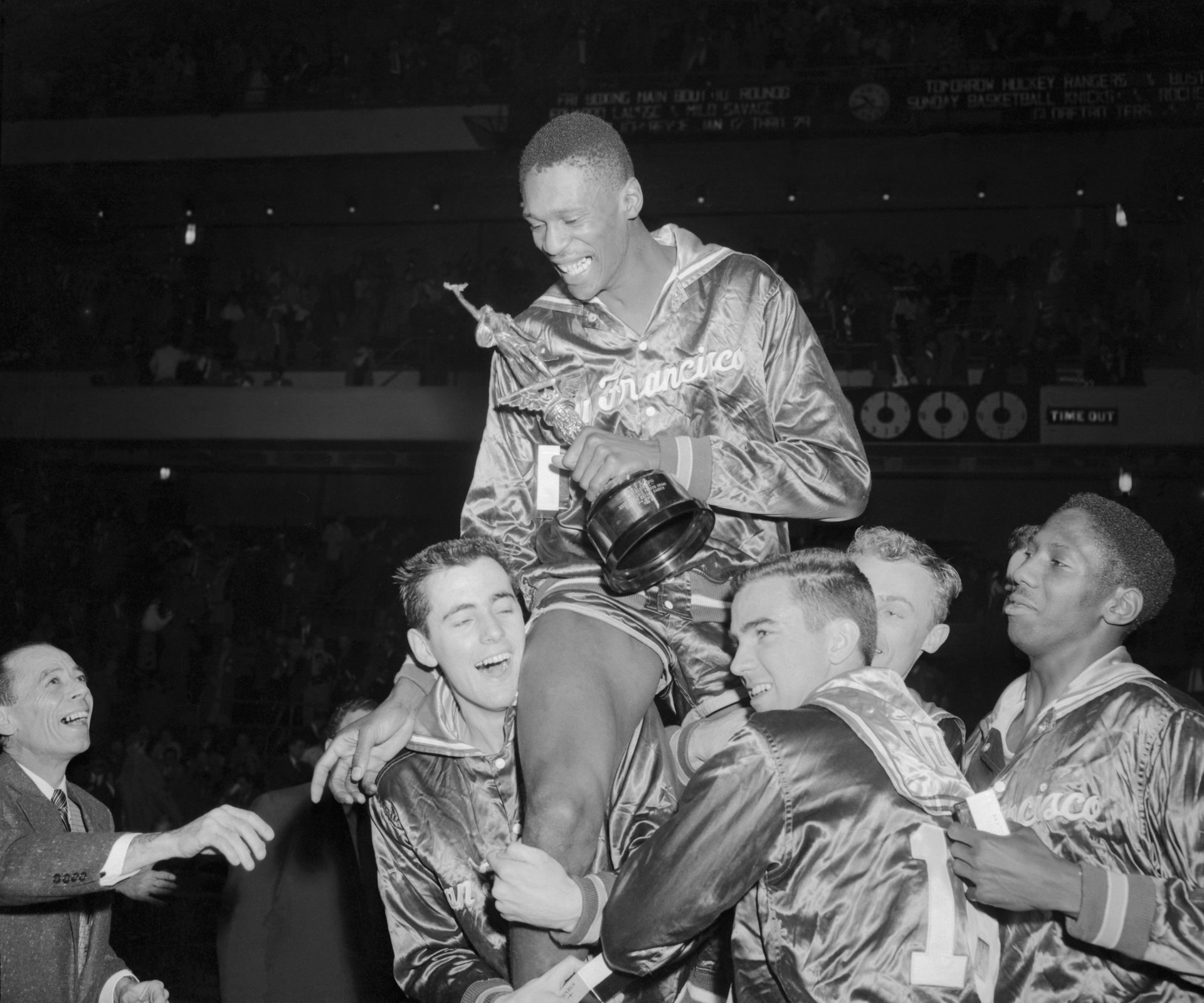 Basketball Player Bill Russell Riding on Teammates Shoulders