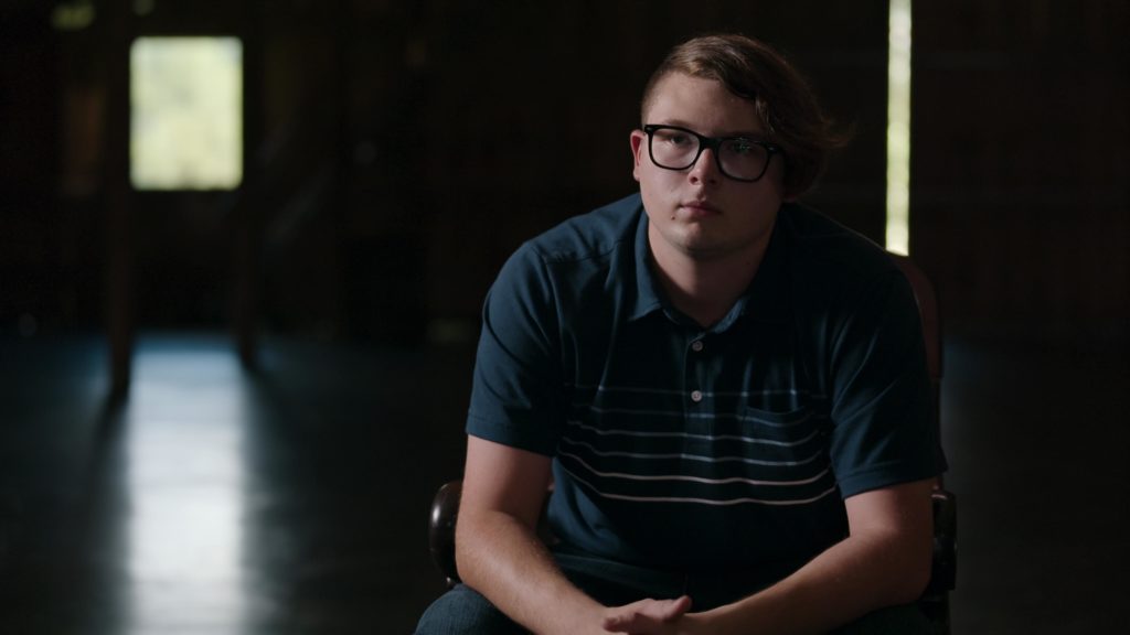 Anthony Templet sits with his hands clasped together and talks to the camera for Netflix'sin I Just Killed My Dad on Netflix