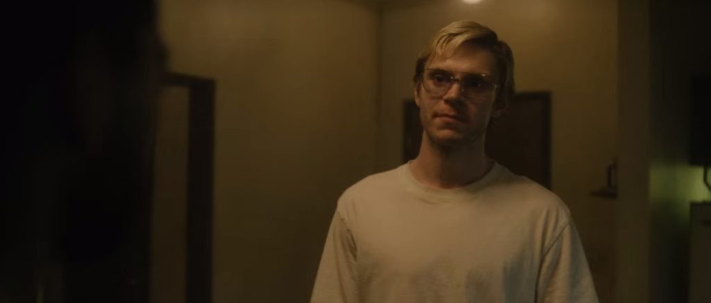 Jeffrey Dahmer, played by Evan Peters, speaks with his neighbour at his apartment on Monster: The Jeffrey Dahmer Story
