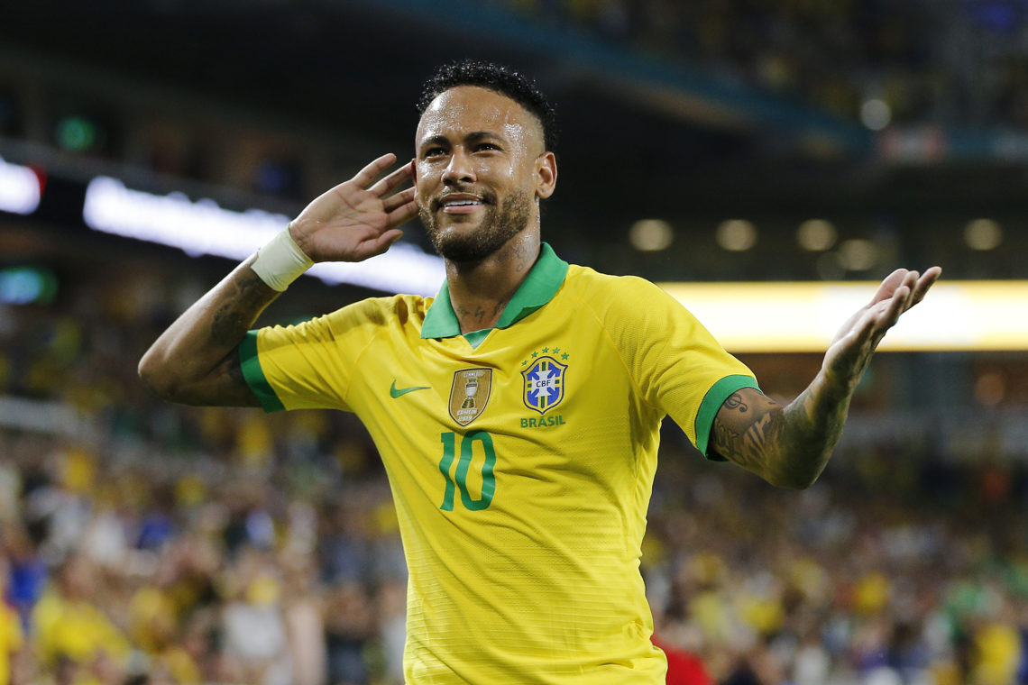 Neymar holds his hand up to his ear in reaction to a goal scored by teammate Casemiro against Colombia in 2019