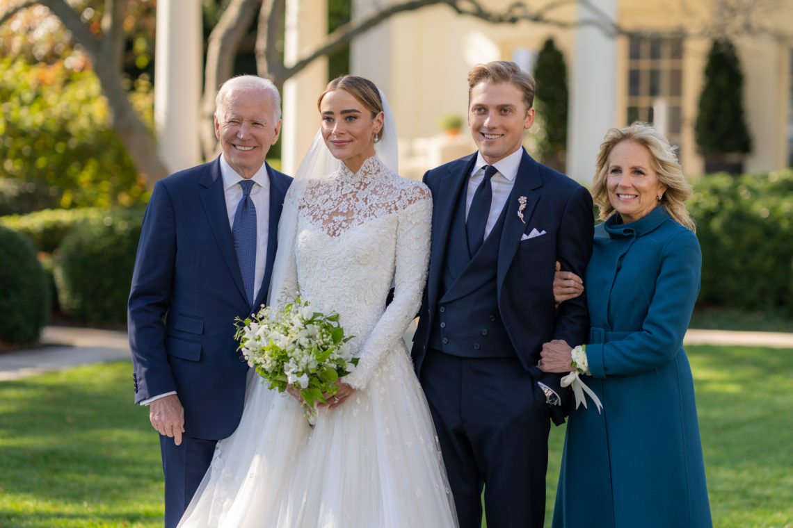 In order from left to right Joe Biden, his granddaughter Naomi, her husband Peter Neal and Jill Biden pose for a photograph in their wedding garments