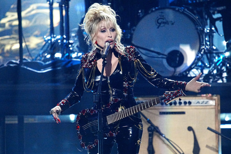 Dolly Parton unveils new song and says she's 'rock star' now to cheering crowd