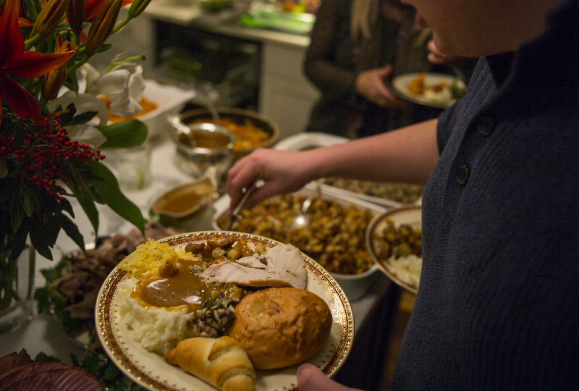 A plate of food on Thanksgiving Day