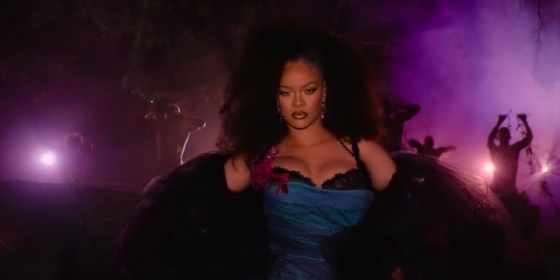 Rihanna walks towards camera in purple lit forest in Savage x Fenty Show Vol. 4