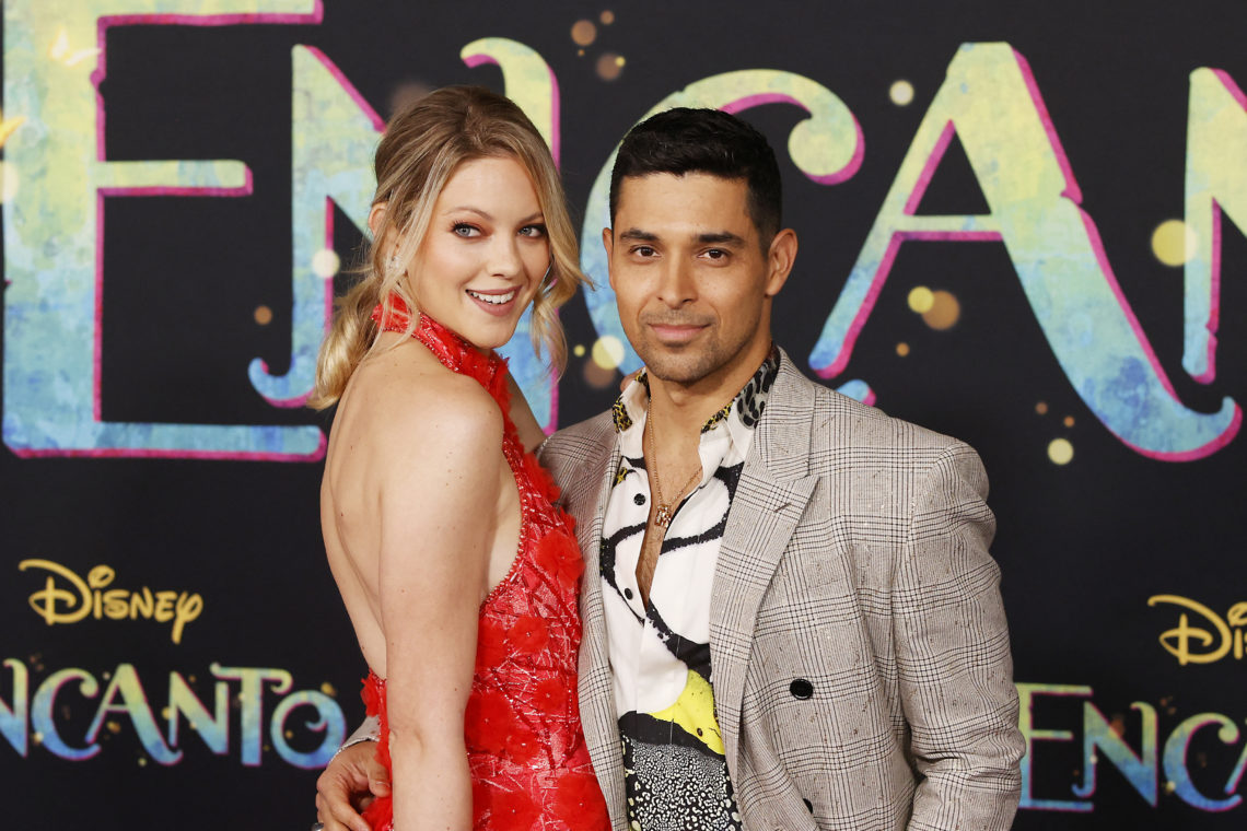 Wilmer Valderrama and his partner Amanda Pacheco pose for a photo at the premiere of Encanto in Los Angeles