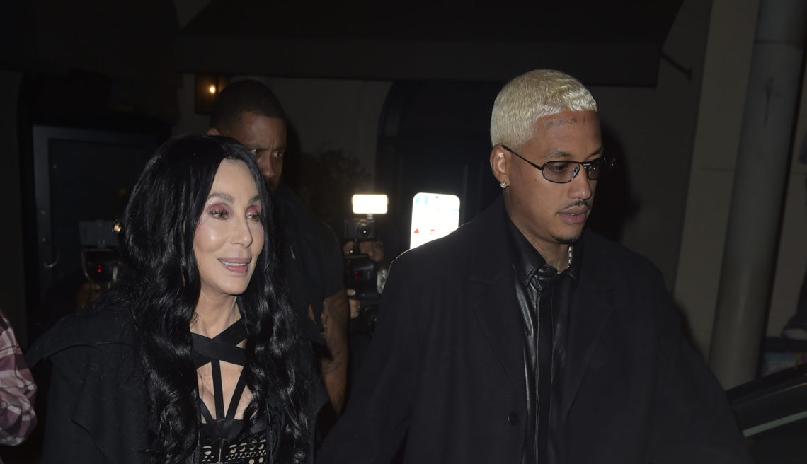 Cher and Alexander Edwards wearing matching black outfits in Los Angeles