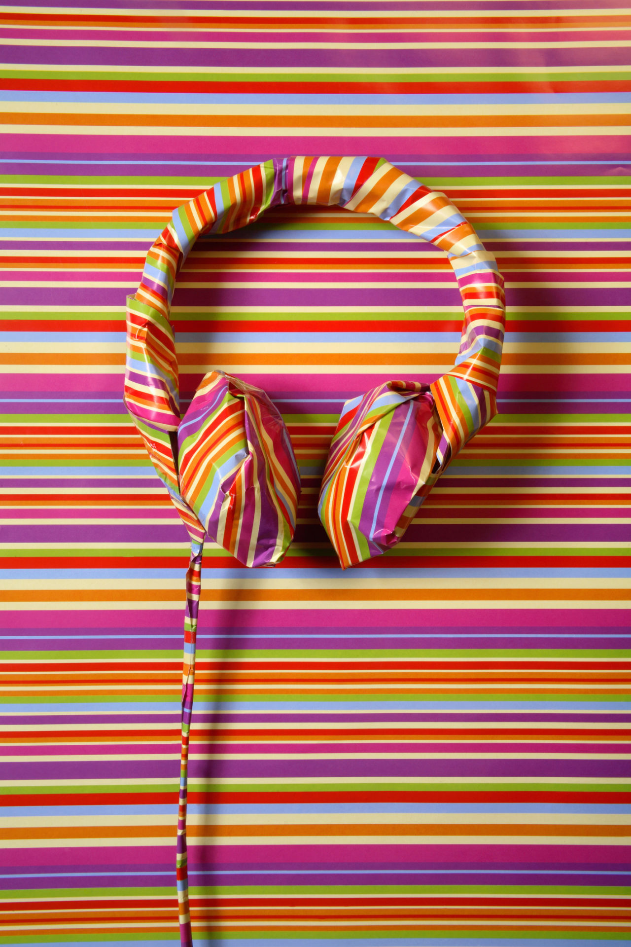 Headphones in striped paper, portrait