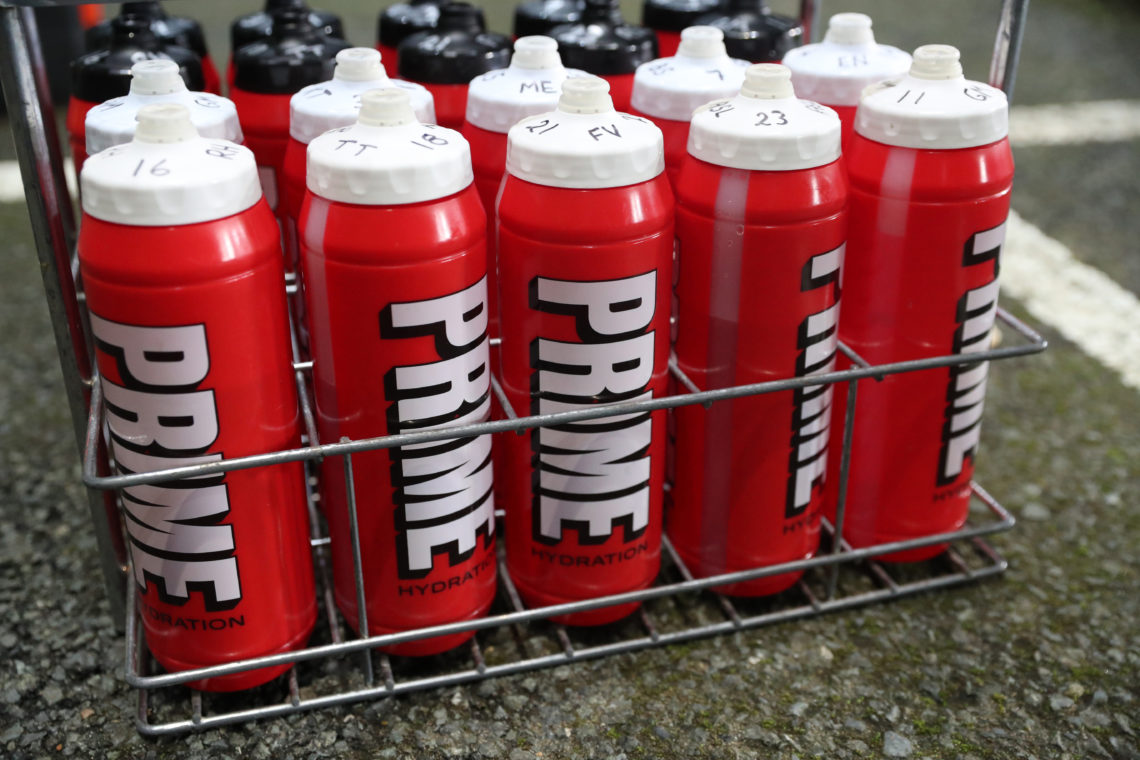 Prime drinks bottles ready for players to drink on a football pitch