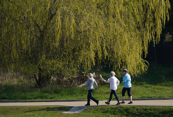 Elderly women walk at a fast pace in a park during the third wave of the coronavirus pandemic on April 20, 2021 in Berlin, Germany. Outdoor exercis...