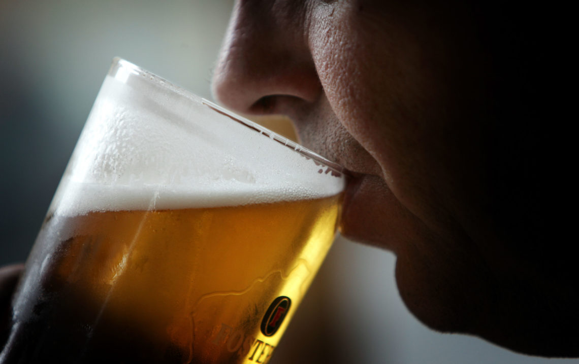 A man drinks a pint of beer on November 26, 2004 in Glasgow, Scotland. The Scottish Executive has announced a major campaign designed to call time ...